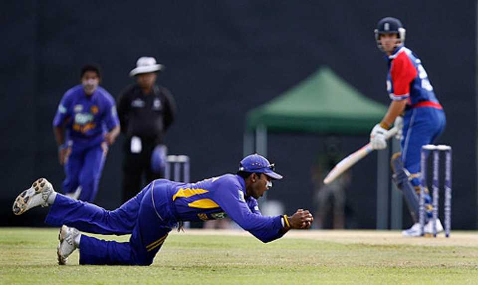 Mahela Jayawardene takes an excellent low catch at slip to dismiss Alastair Cook