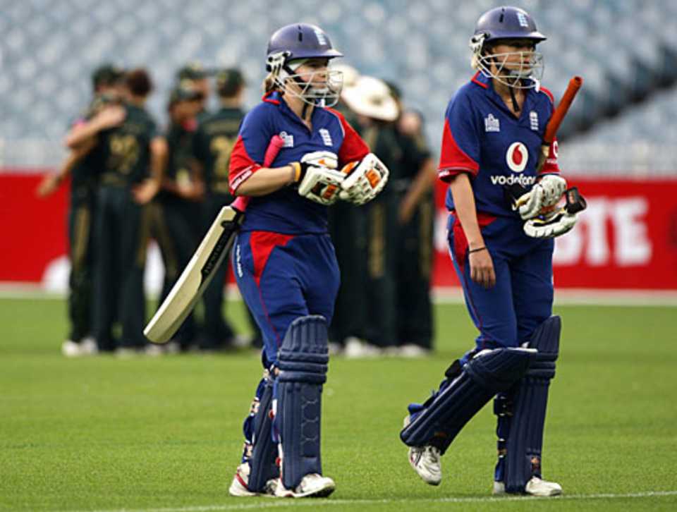 Holly Colvin and Laura Marsh walk back after England's 84-run defeat
