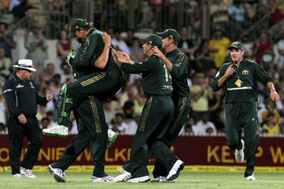 The Australians celebrate a wicket