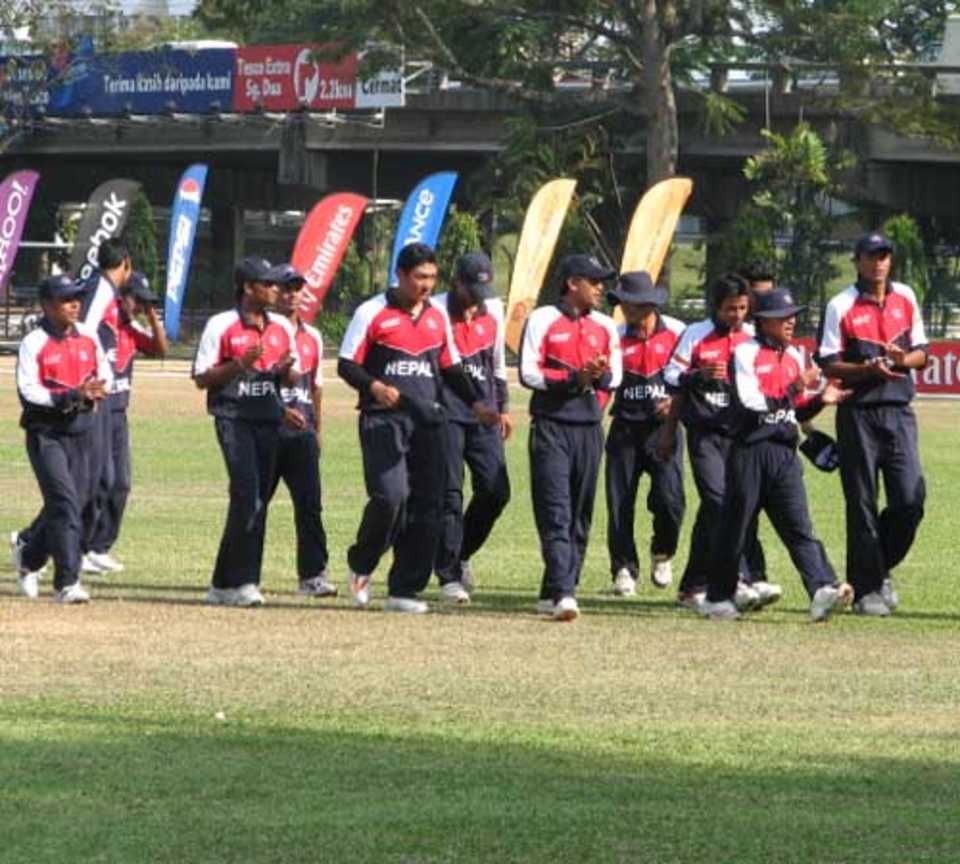 Nepal's players leave the field after their three-run win over Namibia, Namibia U-19s v Nepal U-19s, Under-19 World Cup, Penang, February 21, 2008