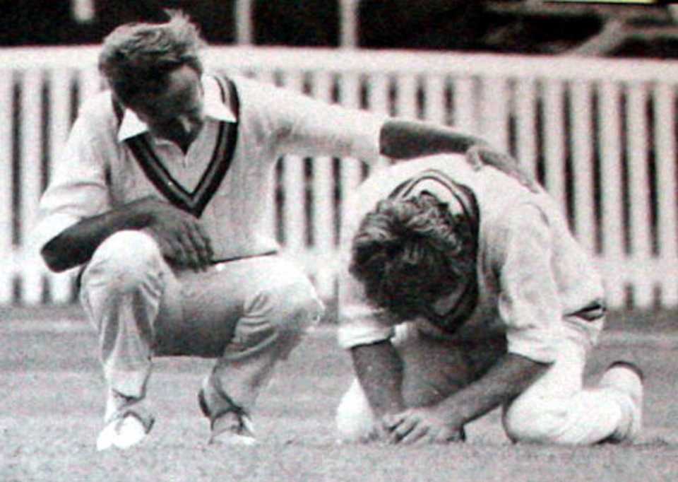 A distraught Peter Lever is comforted by Derek Underwood after felling Ewen Chatfield, New Zealand v England, 1st Test, Auckland, February 24, 1975