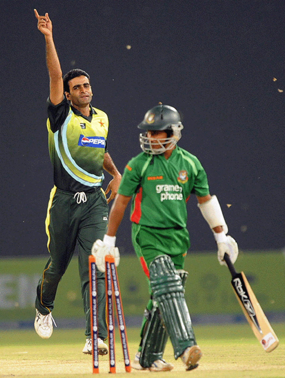 Rao Iftikhar Anjum celebrates the wicket of Mohammad Ashraful