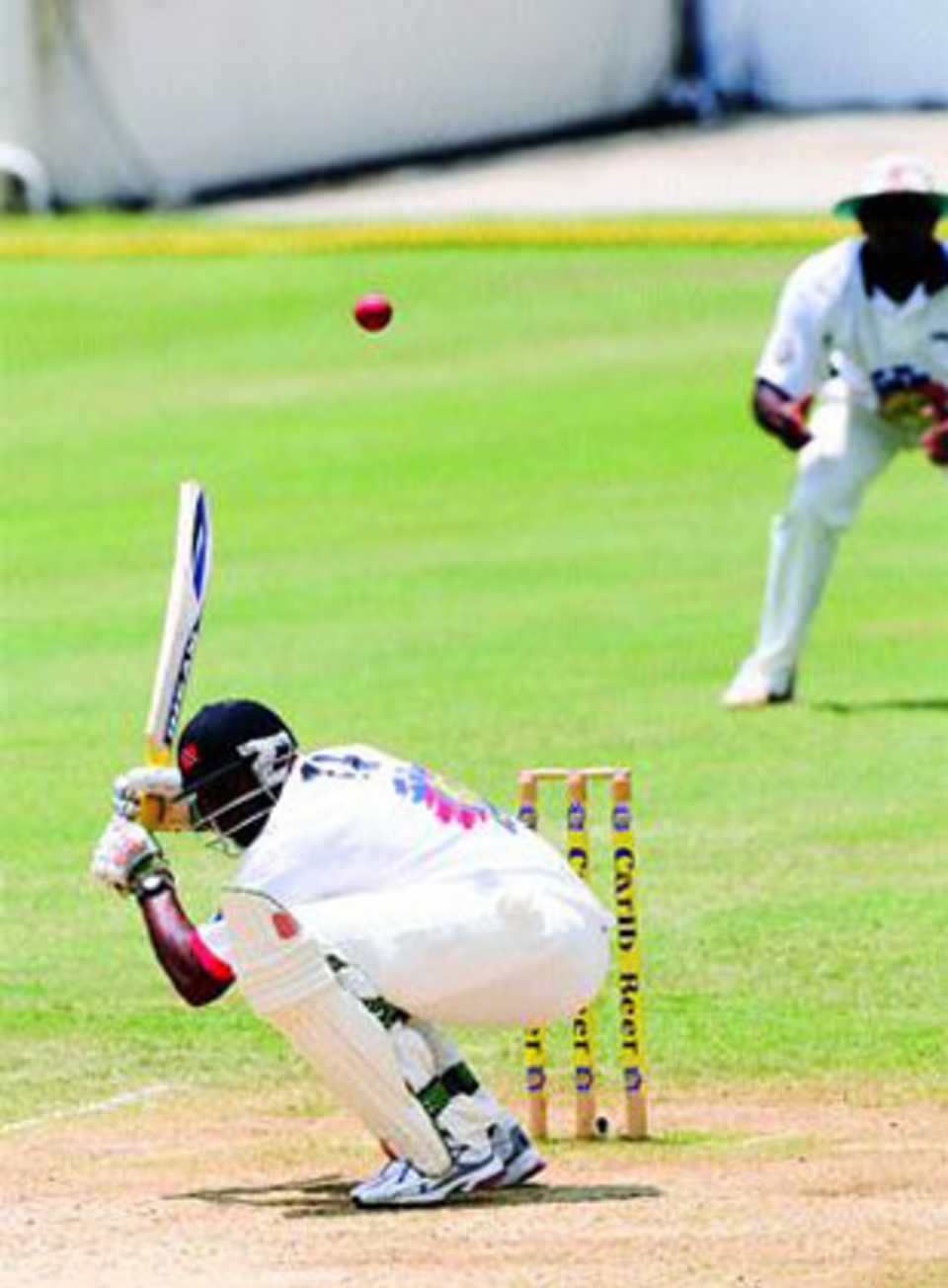 Kieron Pollard ducks under a Jerome Taylor bouncer on the third day of the Carib Beer Challenge final