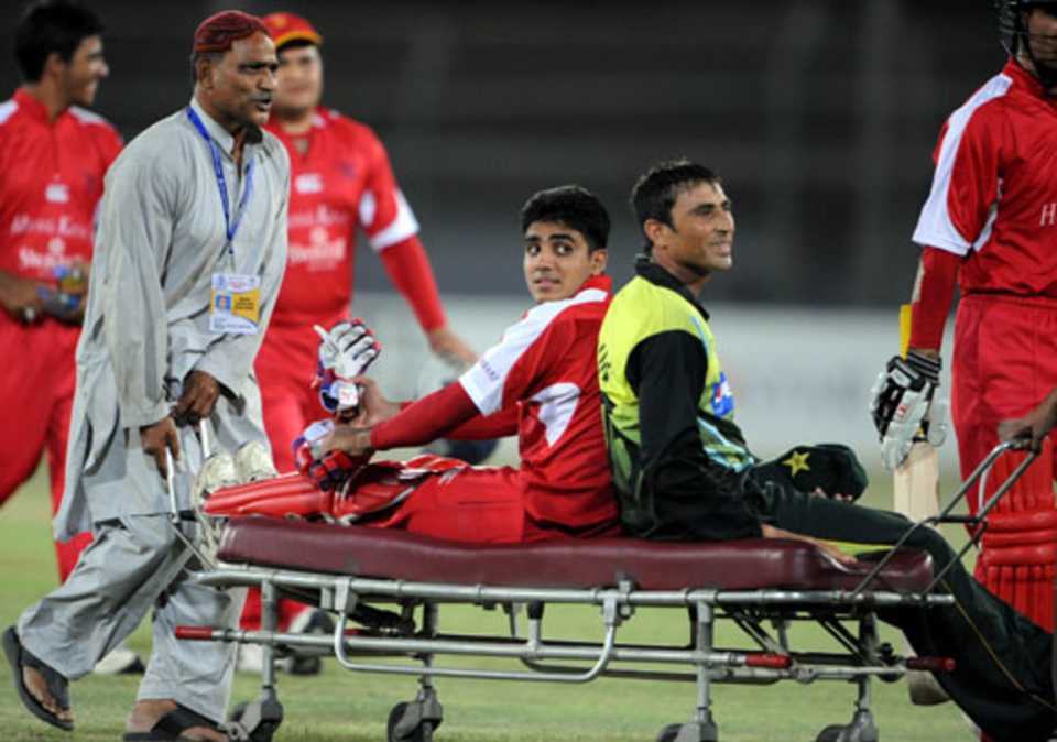 A ride for two:  Zain Abbas and Younis Khan are stretchered off