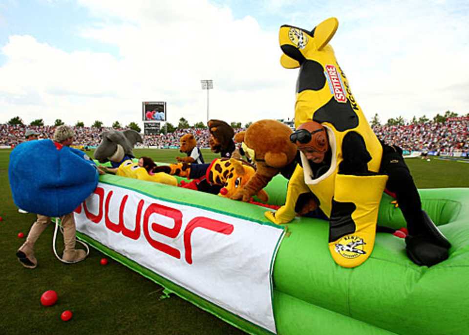 Lanky the Giraffe approaches a hurdle during the mascot race of Twenty20 Finals Day at The Rose Bowl