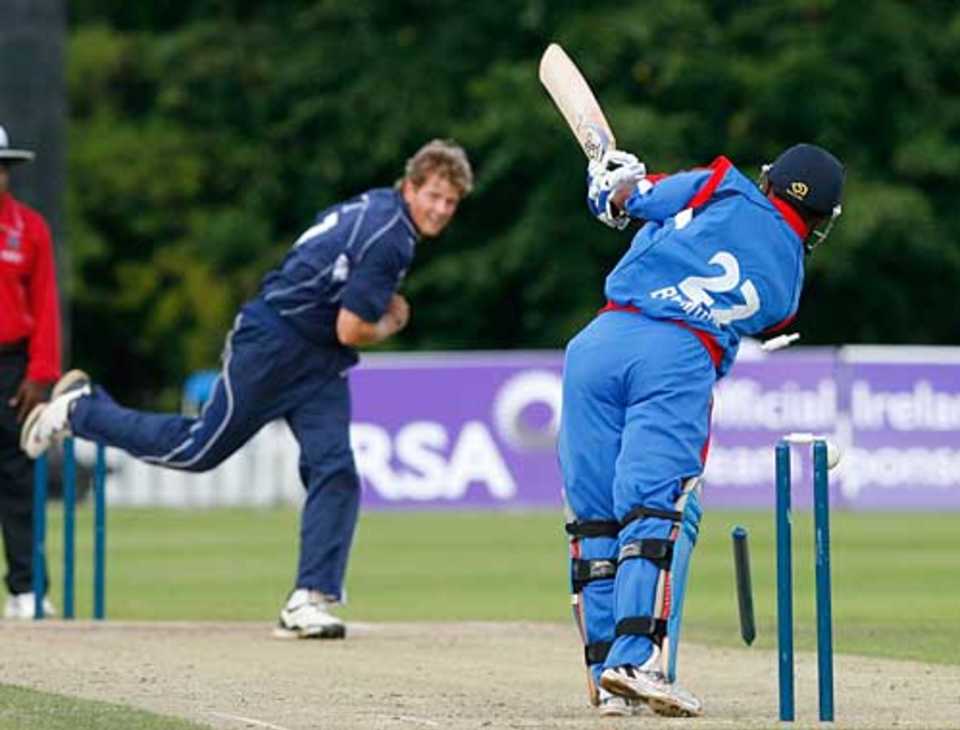Dewald Nel picks up one of his three wickets against Bermuda