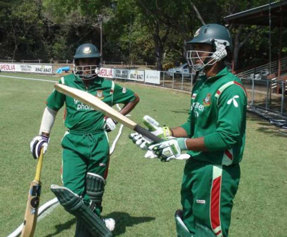 Mehrab Hossain jnr and Mahmudullah wait to enter the field