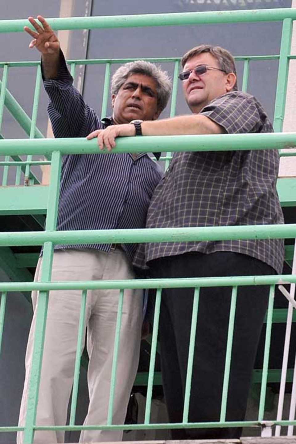 Andy Atkinson (right), the ICC groundsman, inspects the National Stadium in Karachi