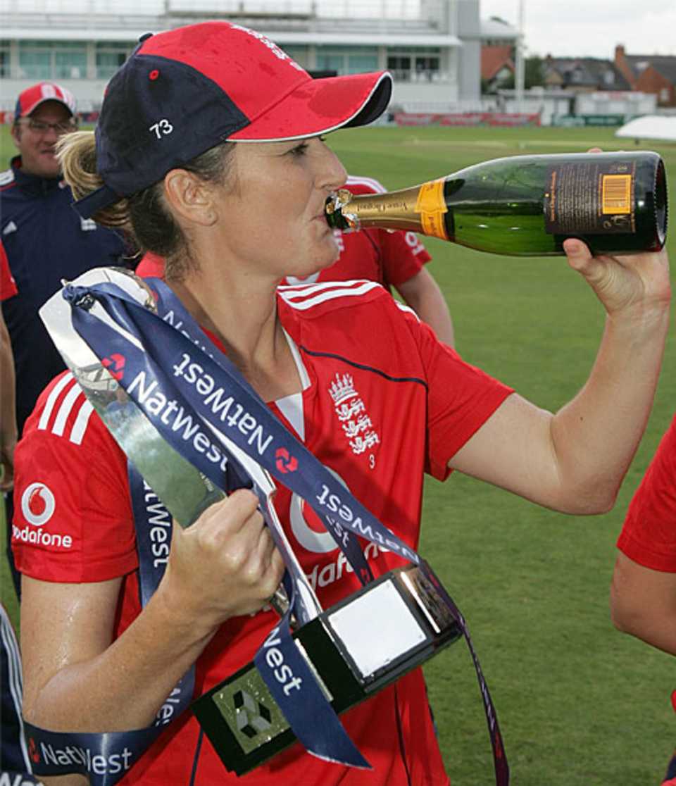 Charlotte Edwards takes a well-deserved swig of champagne
