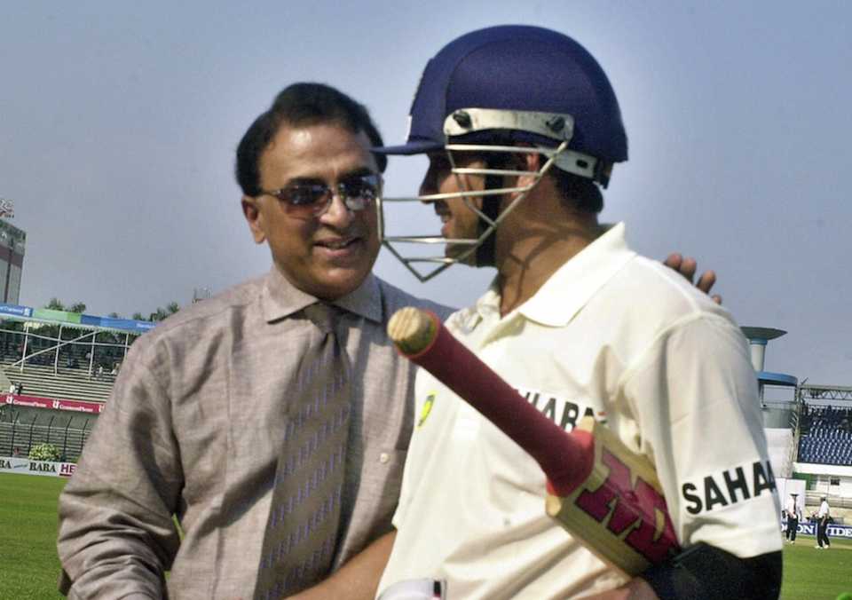 Now equal: Sunil Gavaskar gives Sachin Tendulkar a pat on the back