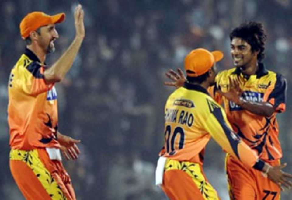 The Ahmedabad Rockets' players celebrate a wicket