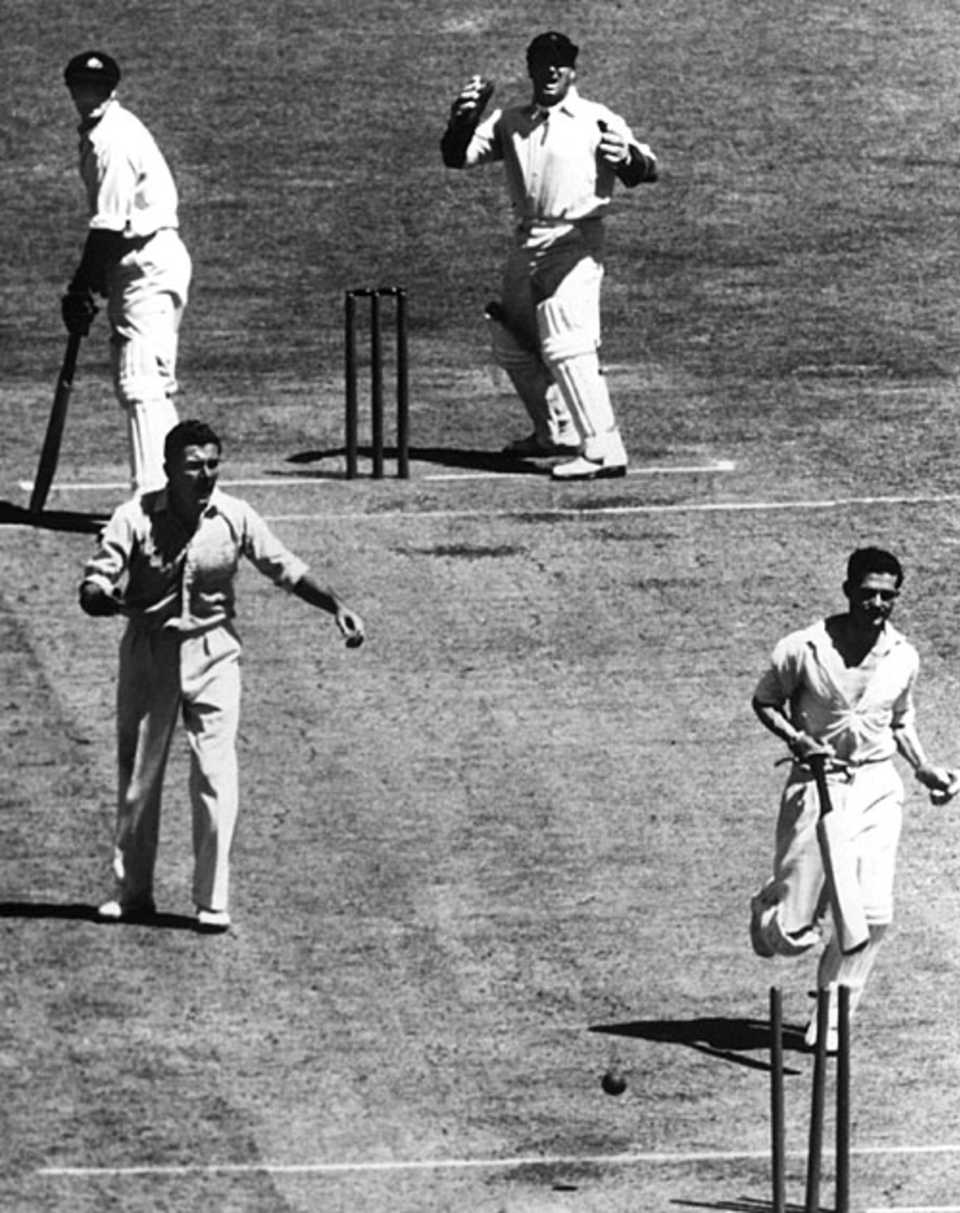 Neil Harvey is run out by Cyril Washbrook