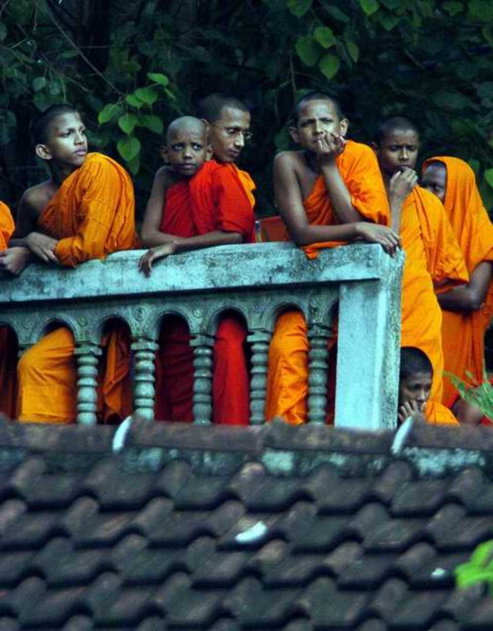 Buddhist monks watch the Test match