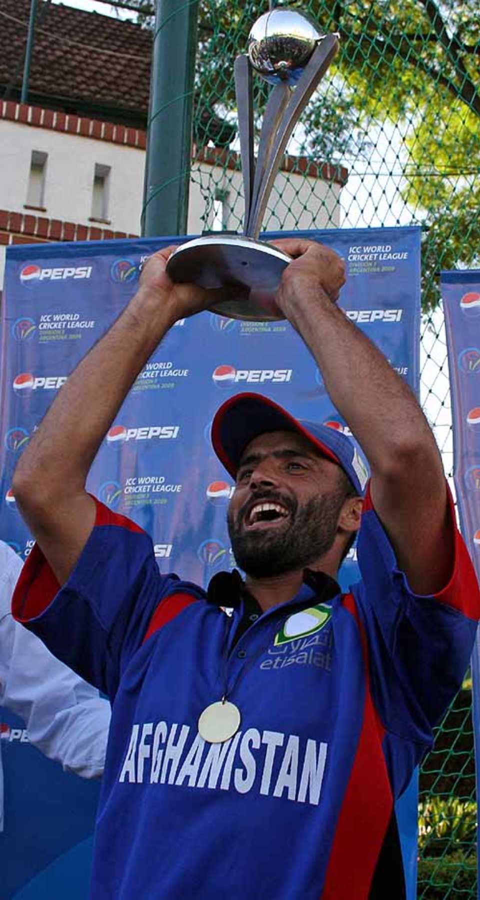 Afghanistan captain Nowroz Mangal lifts the ICC World Cricket League Division 3 trophy 