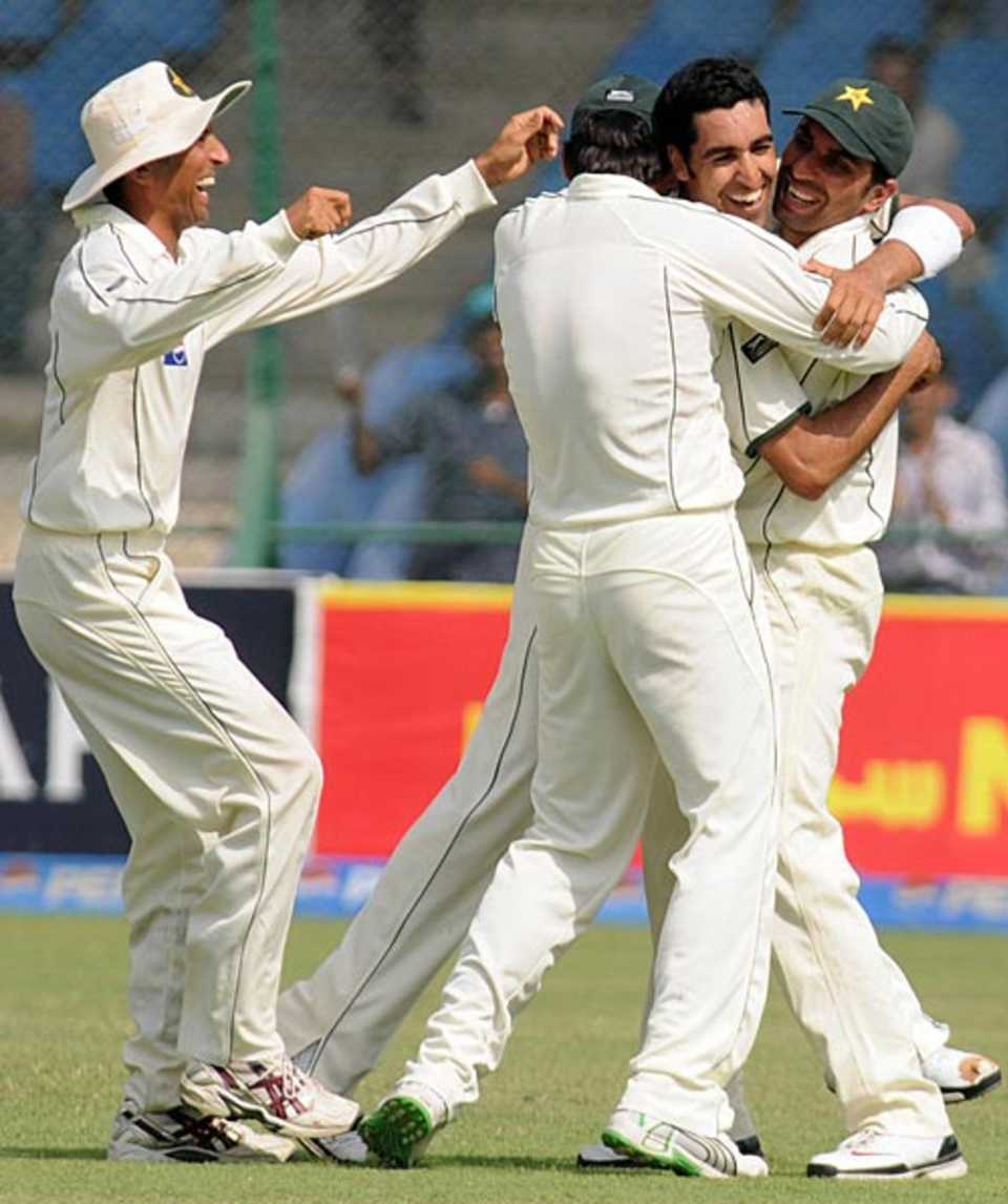 Team-mates mob Umar Gul after the fall of Malinda Warnapura's wicket, Pakistan v Sri Lanka, 1st Test, Karachi, 5th day, February 25, 2009