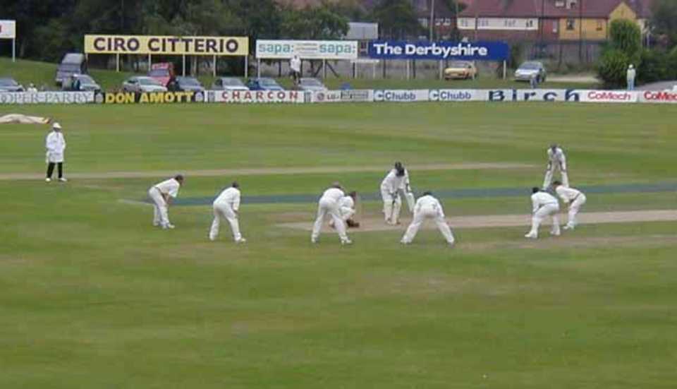 Shane Warne bowling against Derbyshire on a cold day in August