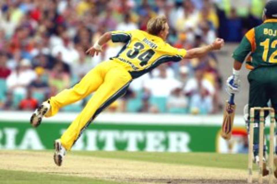 22 Jan 2002: Andy Bichel of Australia dives to take a caught and bowled during the VB Series match between Australia andSouth Africa played at the Sydney Cricket Ground in Sydney, Australia.