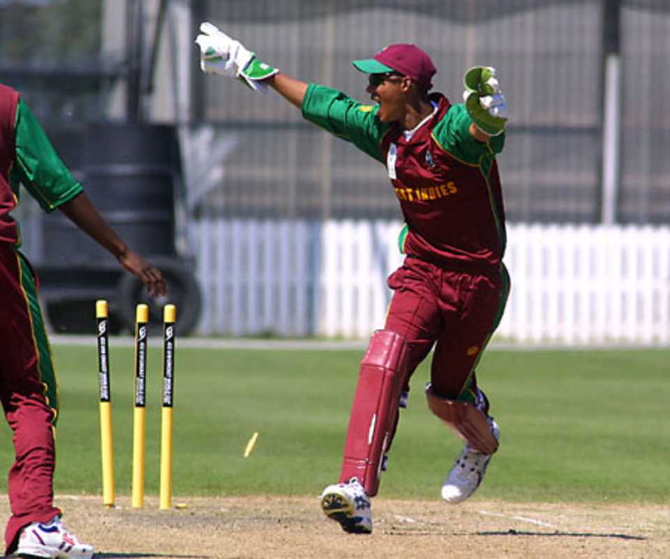 West Indies Under-19 wicket-keeper Lendl Simmons unsuccessfully appeals to the square leg umpire for a run out. ICC Under-19 World Cup Super League Group 1: Pakistan Under-19s v West Indies Under-19s at Lincoln Green, Lincoln, 29 January 2002.