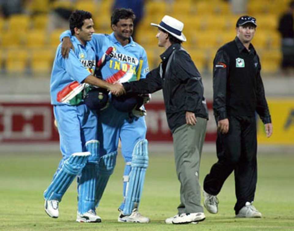 Khan shakes hands with Bowden as he celebrates with Srinath. 5th ODI: New Zealand v India at Wellington, 8 Jan 2003