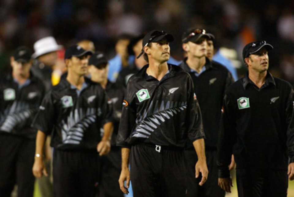 New Zealand captain Stephen Fleming (centre) and Chris Harris (right) leave the field at the end of the match. 6th ODI: New Zealand v India at Eden Park, Auckland, 11 January 2003.