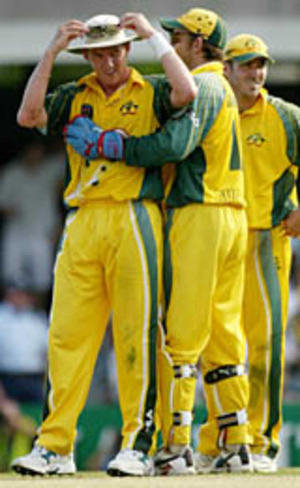 Brett Lee is consolidated after going for 83 runs in his ten overs, Australia v India, VB Series, Brisbane, 5th ODI, January 18, 2004