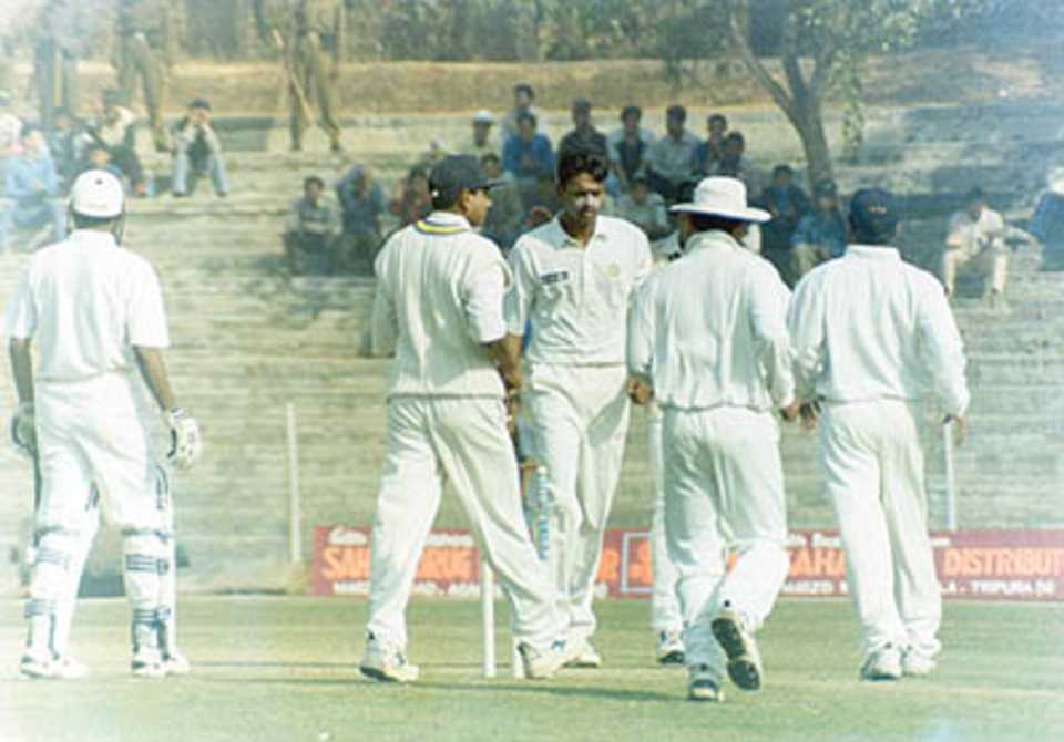 East Zone players rush to Mohanty when he bowled Laxman