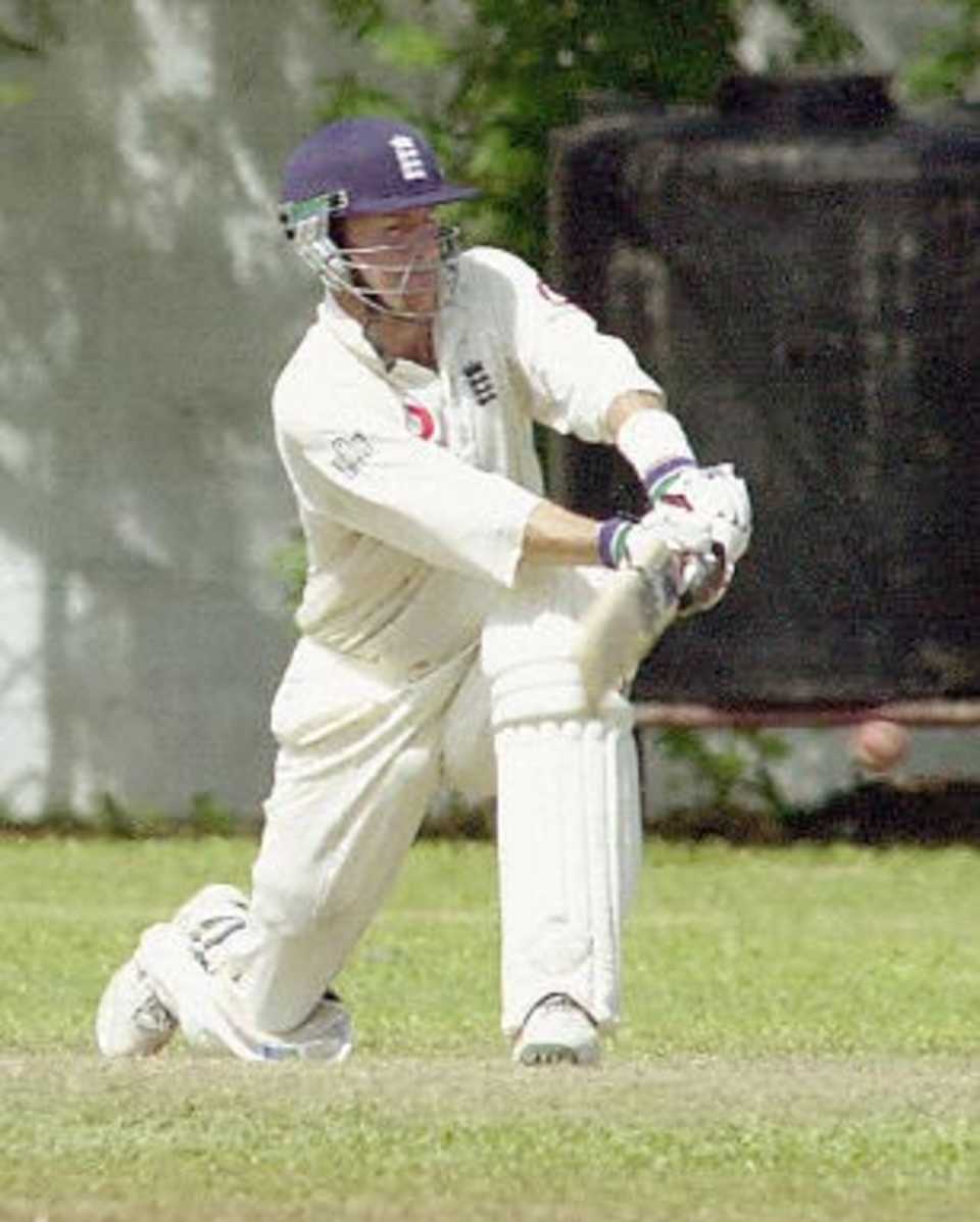 England batsman Craig White sweeps the ball to build the highest individual innings for England on the third day of the second four-day cricket match played at Matara, southern Sri Lanka, on 17 February 2001.