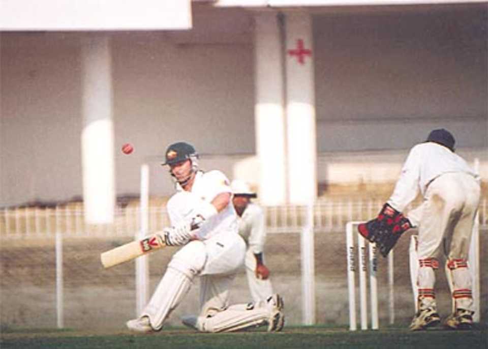 Steve Waugh sweeps during a brief knock of 17, Australia in India, 2000/01, India 'A' v Australians, Vidarbha C.A. Ground, Nagpur, 17-19 February 2001 (Day 3).