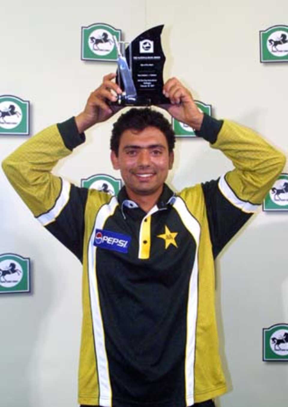 Pakistan off spinner Saqlain Mushtaq holds the National Bank Player of the Match trophy above his head, after taking 3-26 from nine overs. 3rd One-Day International: New Zealand v Pakistan at WestpacTrust Stadium, Wellington, 22 February 2001.