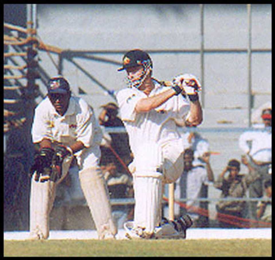 Steve Waugh goes down on his knees to play a cover drive. Australia in India 2000/01, Mumbai v Australians, Brabourne Stadium, Mumbai, 22-24 Feb 2001 (Day 3).