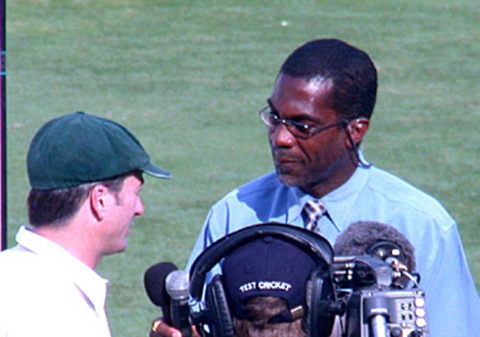 Australian captain Steve Waugh speaks to Michael Holding during the on field presentation