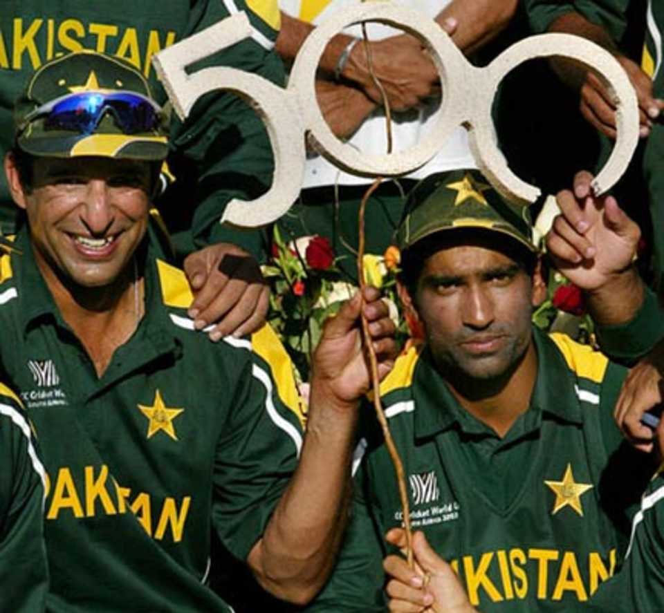 Wasim Akram poses with team mate Yousuf Youhana after claming 500 ODI wickets