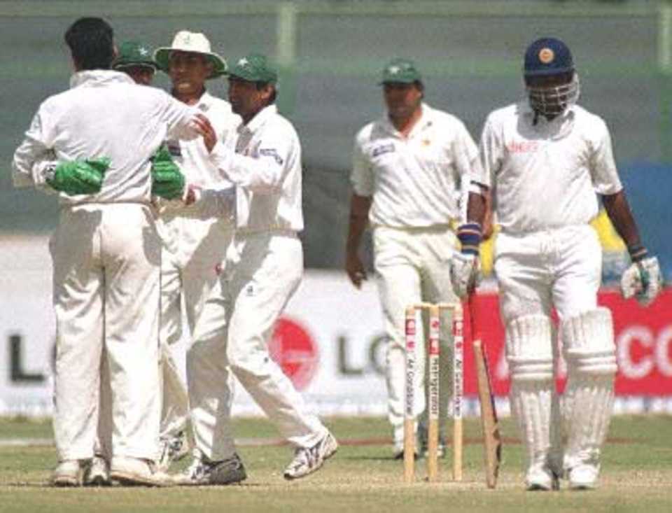 Waqar is embraced after he captured the all important wicket of Sanath Jayasuriya