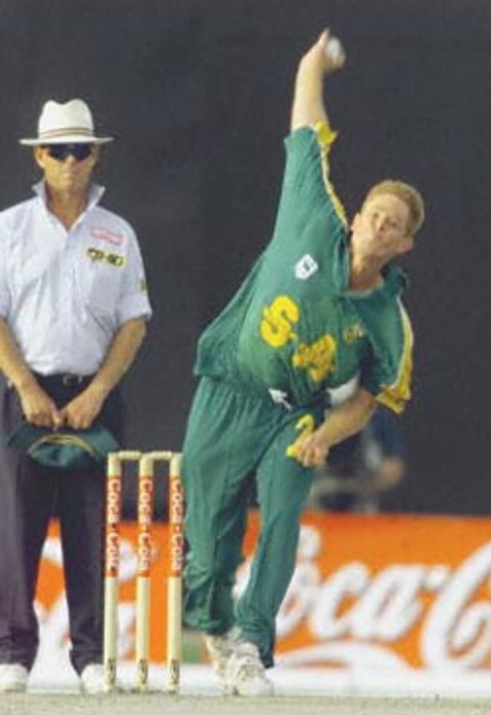 South African bowler Shaun Pollock bowls to Pakistani batsman Yousuf Youhanna at the three-nation Sharjah  in the last match of the preliminary league.