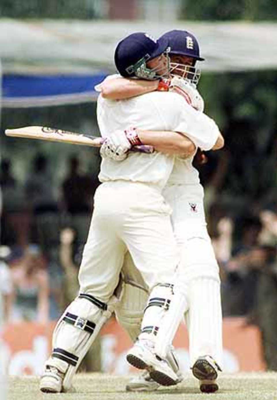White and Giles embrace as England win the Second Test at Kandy