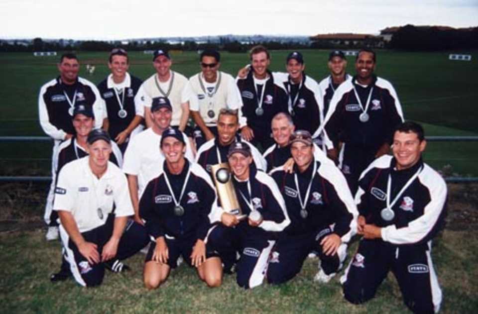 The Auckland team pose with their winners medals and the State Championship trophy. State Championship: Auckland v Wellington at Auckland, 24-27 Mar 2002