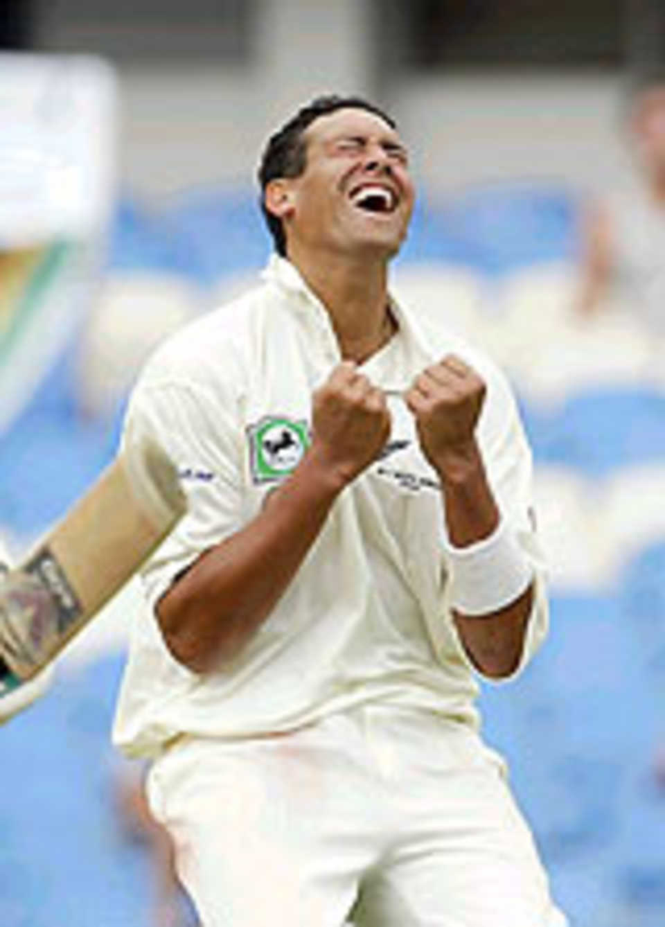 Daryl Tuffey celebrates a wicket
