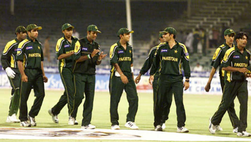 Pakistan team make their way to the pavilion