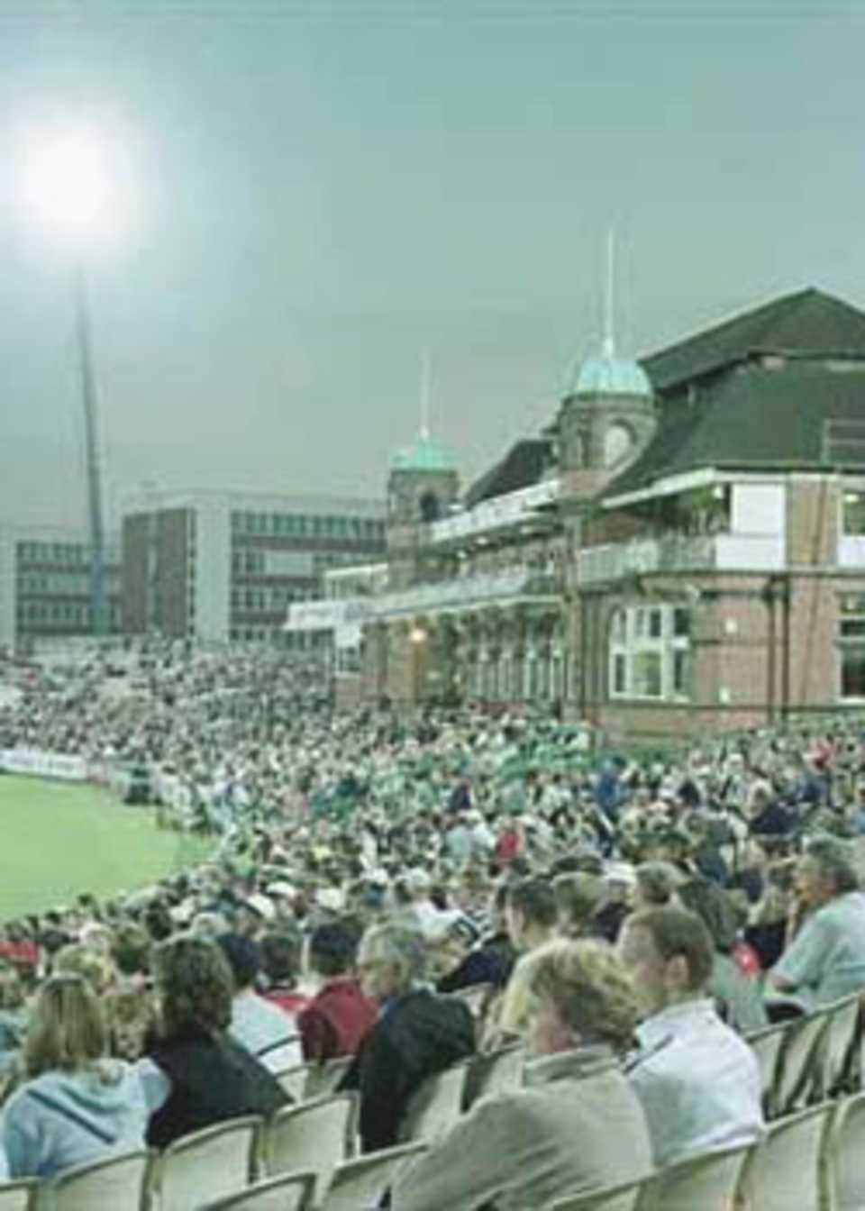 The Old Trafford pavilion basking in the glory of the flood lights, National League Division One, 2000, Lancashire v Yorkshire, Old Trafford, Manchester, 27 June 2000.