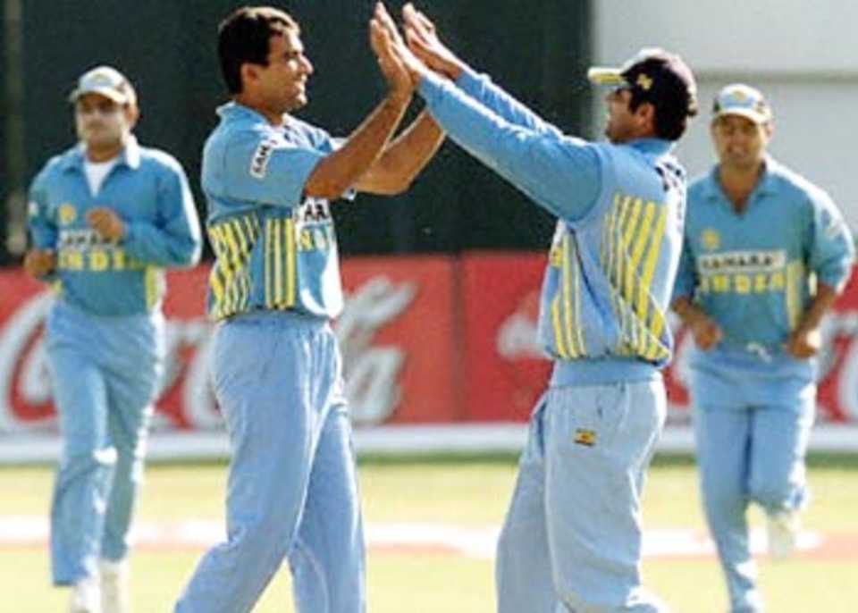 Zaheer who grabbed four wickets is greeted by Dravid