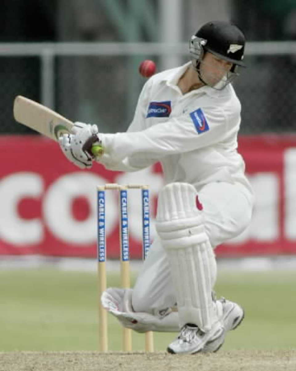 New Zealand batsman Nathan Astle avoids a bouncer from West Indies bowler Darren Powell during his second innings of 77. 1st Test: West Indies v New Zealand at Kensington Oval, Bridgetown, Barbados, 21-25 June 2002 (23 June 2002).