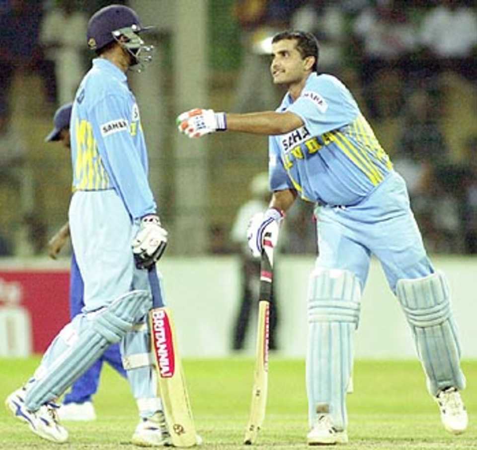 Ganguly exchanges pleasantries with Dravid after hitting a six