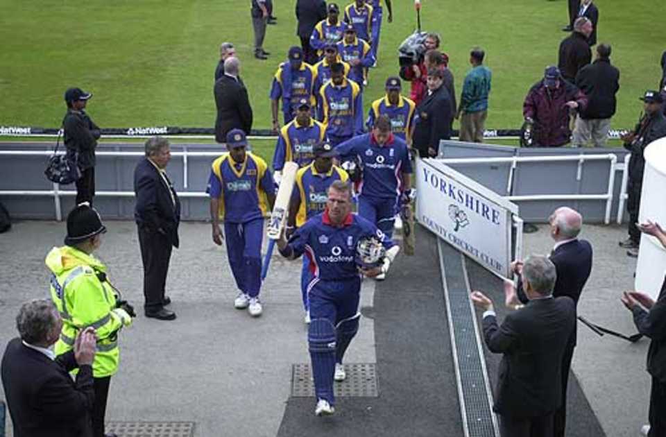 Stewart as victor, leads off the vanquished , England v Sri Lanka at Leeds, July 2002