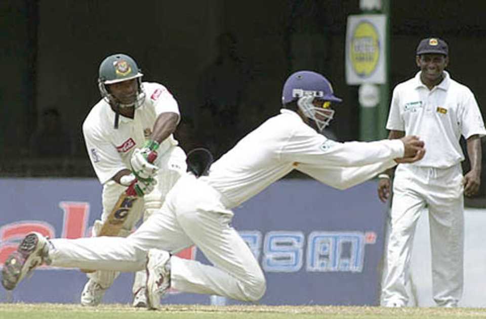 Aminul Islam is caught by Sangakkara at silly point, delighted Skipper looks on