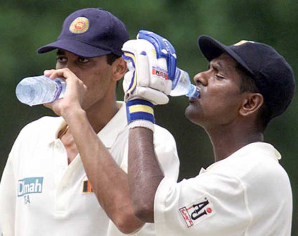 Players take a drinks break during the second Test at Sinhalese Sports Club Ground