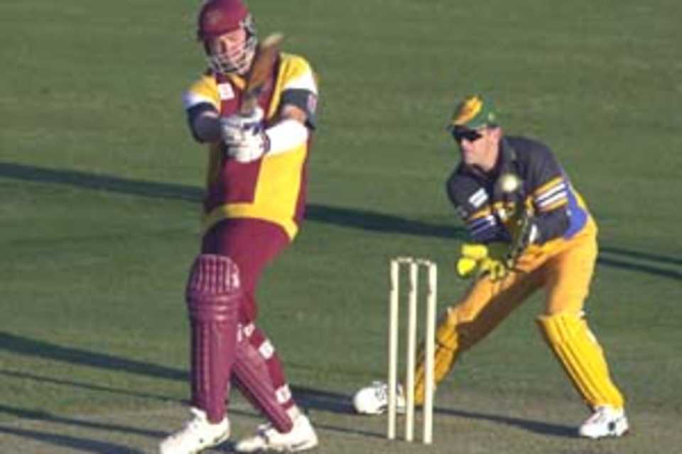 Muller batting as Gilchrist looks on, Queensland XI v Australian XI, 2000/01