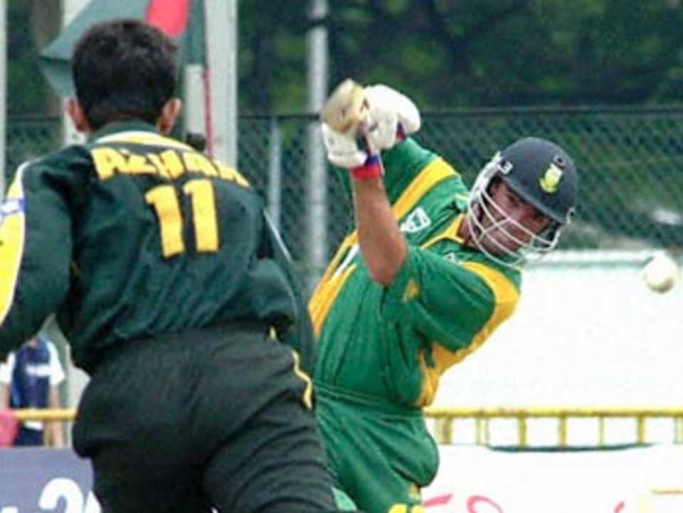 South African batsman Nicky Boje smashes the ball through the offside in the Singapore Challenge 2000. Godrej Singapore Challenge 2000/01, Final Pakistan v South Africa, Kallang Ground, Singapore 27 Aug 2000.