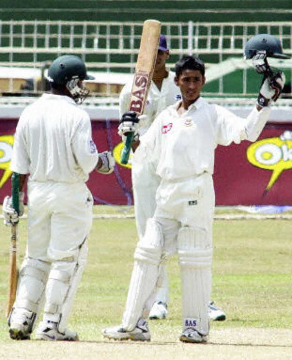 Bangladesh batsman Mohammad Ashraful raises his bat to celebrate his maiden century