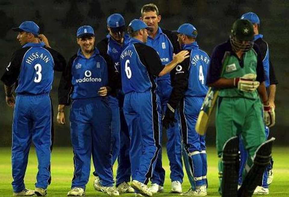 20 Oct 2000: The England team celebrates after Alec Stewart took the catch off Andrew Caddick to take the first wicket of Shahid Afridi of the Governors XI during the Governers XI v England One Day International match at the National Stadium, Karachi, Pakistan.