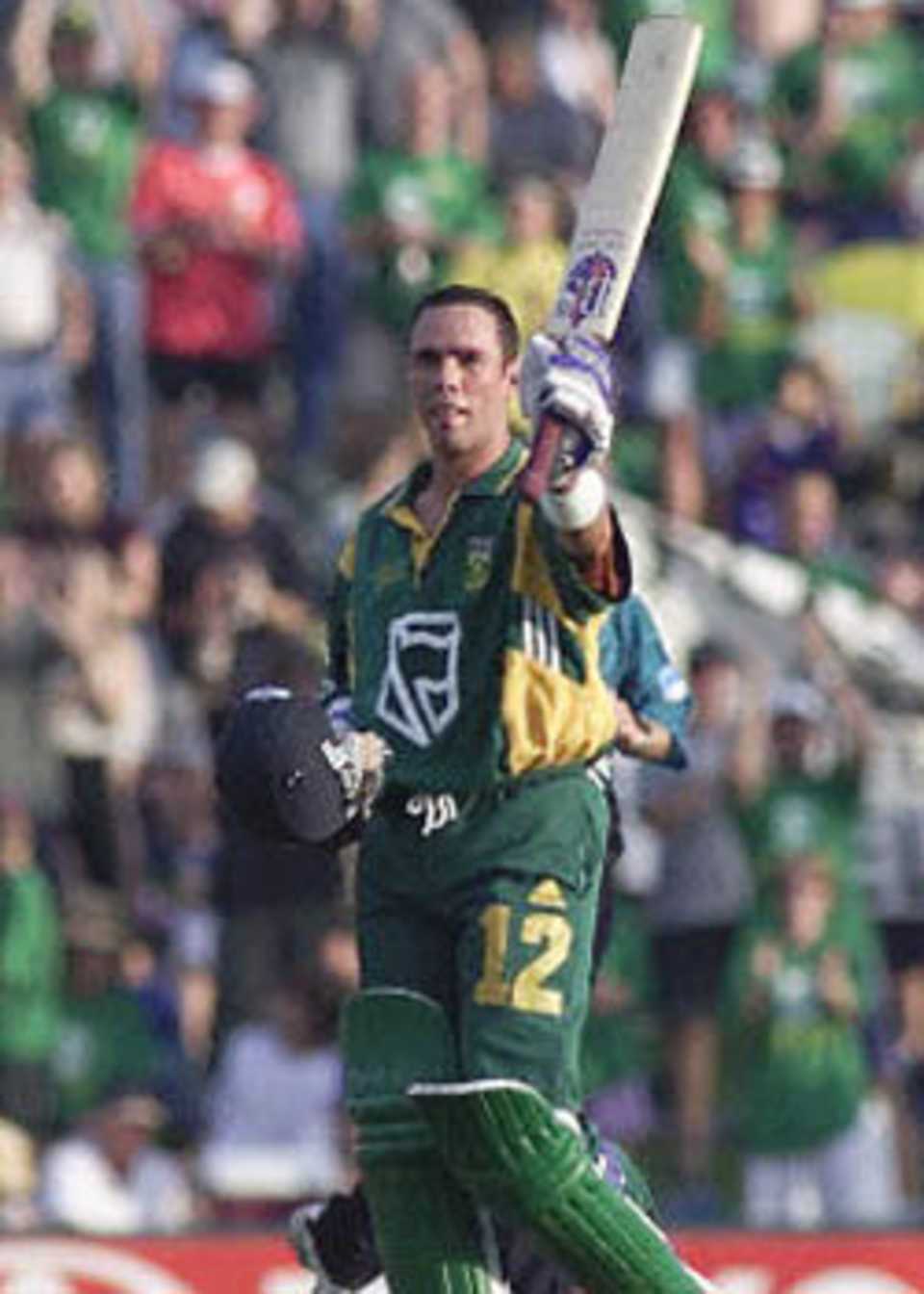 Nicky Boje raises his bat after scoring a hundred, New Zealand in South Africa, 2000/01, 3rd One-Day International, South Africa v New Zealand, SuperSport Park, Centurion, 25 October 2000.